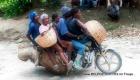 Look... A Haitian Taxi Moto carrying 4 passengers plus the driver
