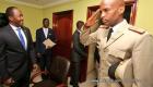 PHOTO: Haiti - A Haitian Military man Salutes as Information DG watches proudly