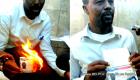 PHOTO: Haitian professor Kersaint Berlins Belande burns his US Visa - Response to Donald Trump