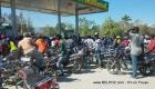 So many motorcycles at a gas station in Haiti during a gas shortage