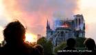 People stand in shock as the Notre Dame Cathedral in Paris France burns down