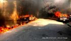 Haiti - Cars parked in the vicinity of Radio and Television Caraibes on Fire