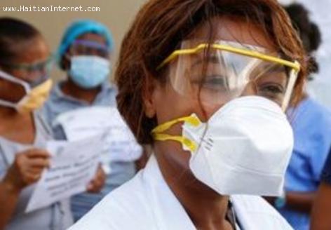 A hospital worker in Haiti with face mask during covid-19 pandemic