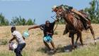 Del Rio Texas: White man on a horse gathering black Haitians like slaves - You probably thought it was a slave movie
