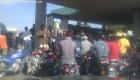 Gas Shortage in Haiti - Motorcycles Storm a Pump with a Little Gas