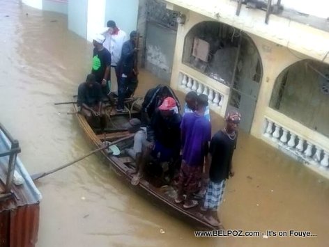 PHOTO: Haiti - Flooding in Cap Haitien - Citizens are using a boat to get around the city...