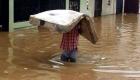 PHOTO: Cap Haitien Haiti Flooded, one man tries to save his belongings
